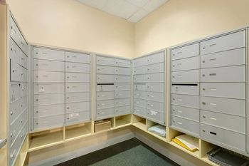 A room with a row of filing cabinets.